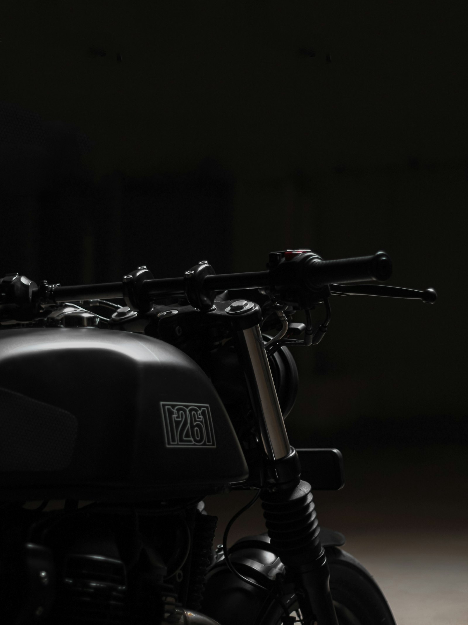 A motorcycle in a dark garage